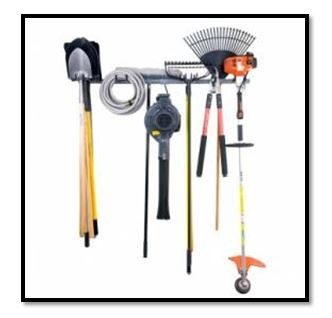 A wall-mounted rack perfect for garage organization, holding a shovel, hose, rake, leaf blower, hedge shears, hoe, and string trimmer. - Beise Real Estate