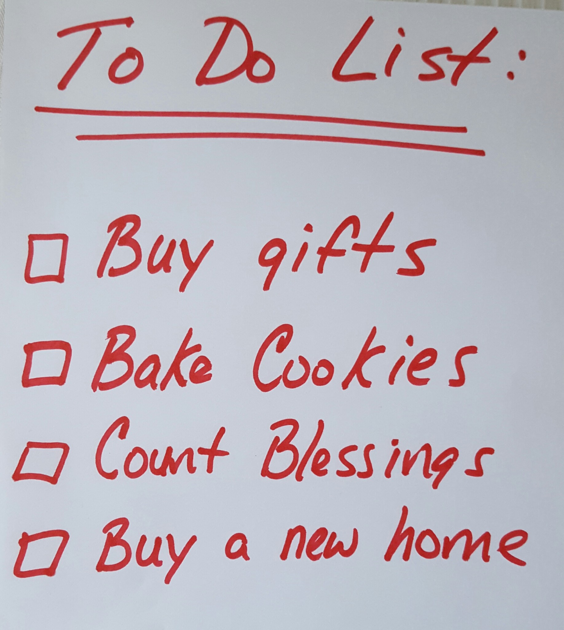 Handwritten to-do list in red ink with checkboxes: Buy gifts, Bake Cookies, Count Blessings, Holiday Wishes, Buy a New Home. - Beise Real Estate