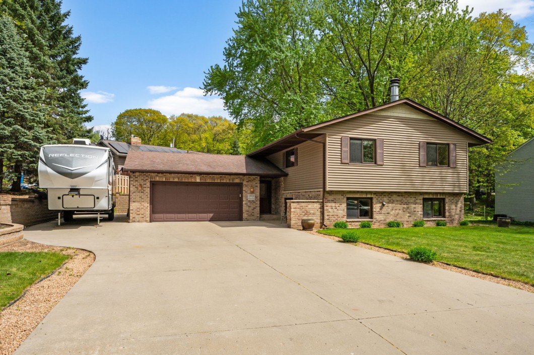 Beautiful home on wonderful setting, landscaped yard, trees, Concrete pad for RV/Trailers!