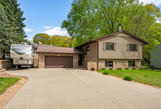 Beautiful home on wonderful setting, landscaped yard, trees, Concrete pad for RV/Trailers!