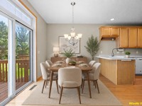 Dining area at 17595 Wiedman Way features a set table, six beige chairs, and a chandelier beside a kitchen with wooden cabinets; sliding glass door opens to a deck. "Virtually Staged" is noted in the corner of this Eden Prairie home. - Beise Real Estate